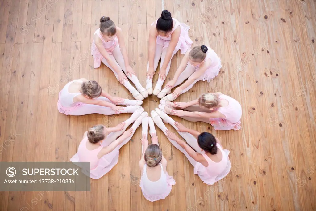 Elevated view of young ballerina group in circle