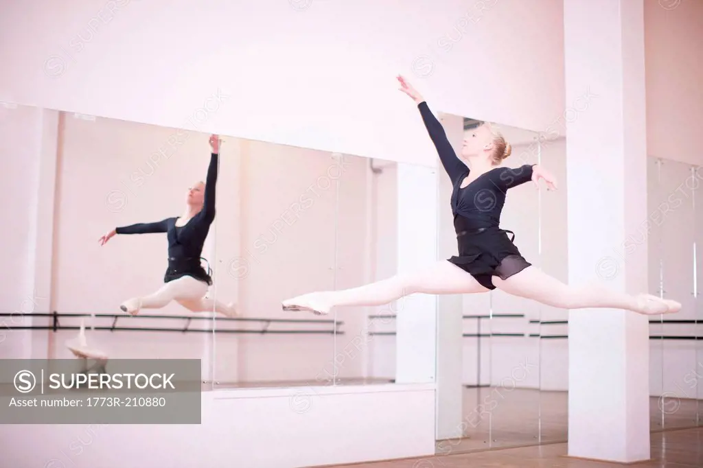 Ballerina practicing mid air jump