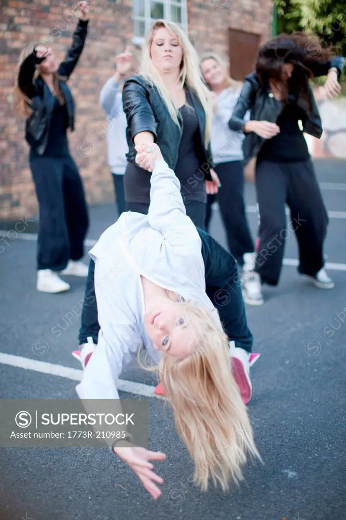 Girls dancing in carpark