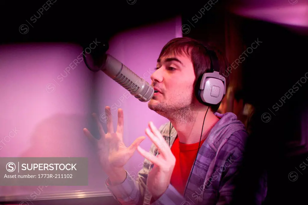 Young man broadcasting in recording studio