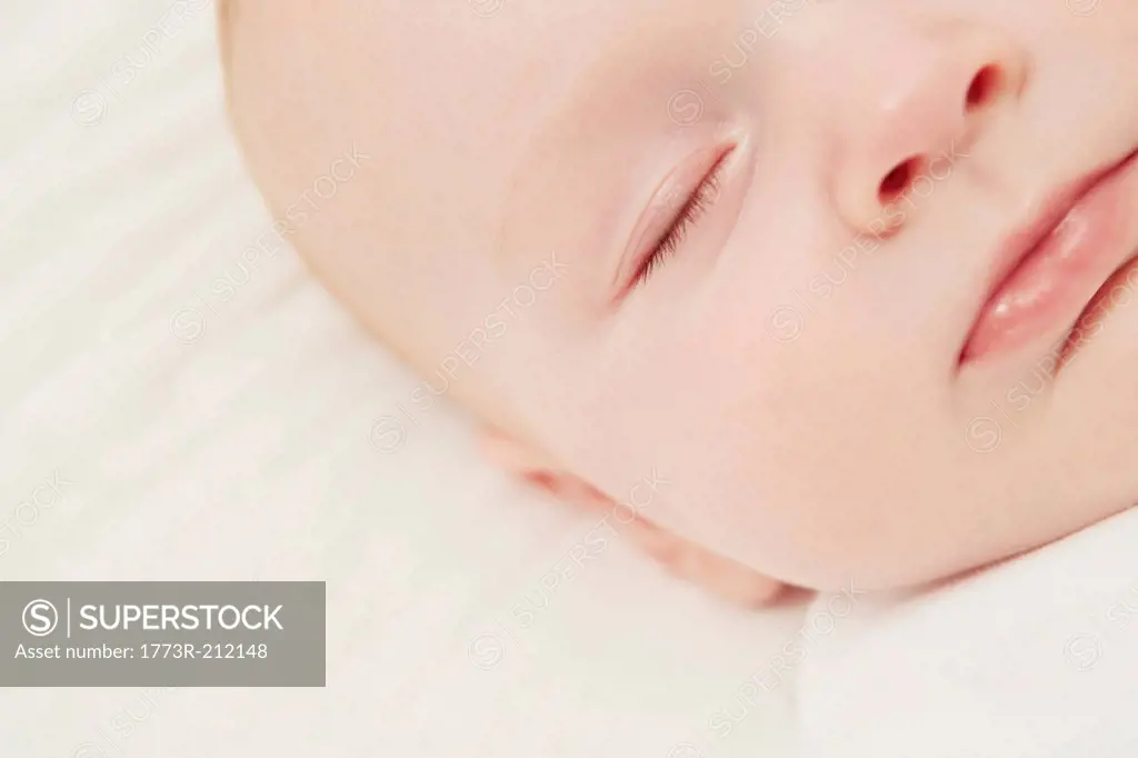 Close up of baby in crib sleeping