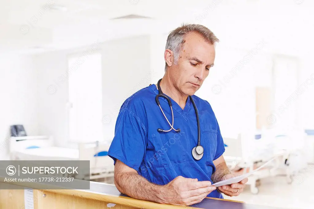 Doctor reading notes