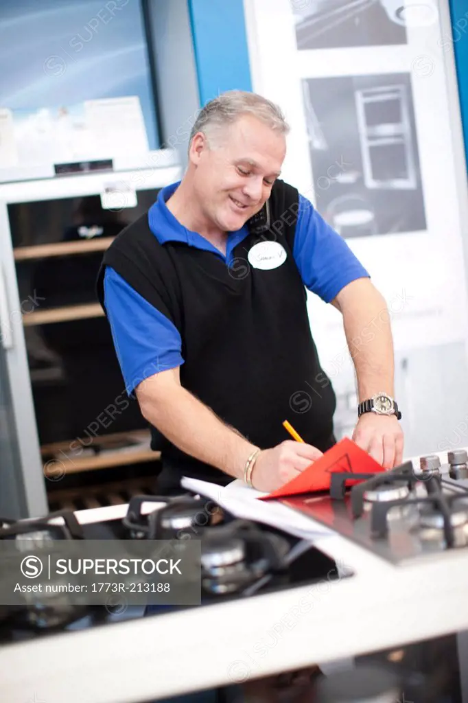 Kitchen appliance salesman in showroom