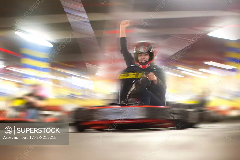 Mid adult woman driving go cart