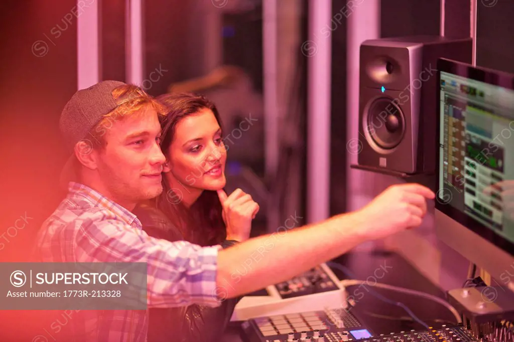 Young adults in college recording studio