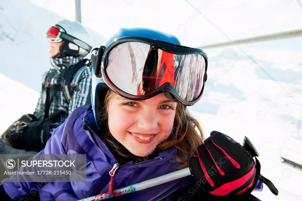 Portrait of young girl on ski lift, Les Arcs, Haute-Savoie, France