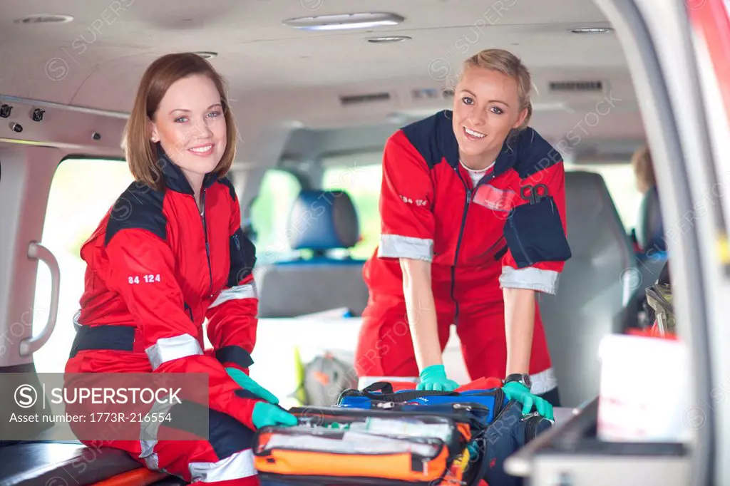 Portrait of two female paramedics in ambulance