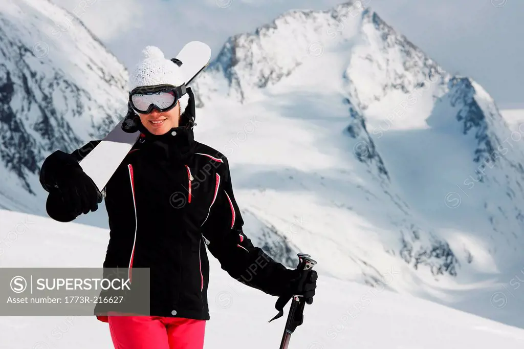 Portrait of woman holding skis, Obergurgl, Austria