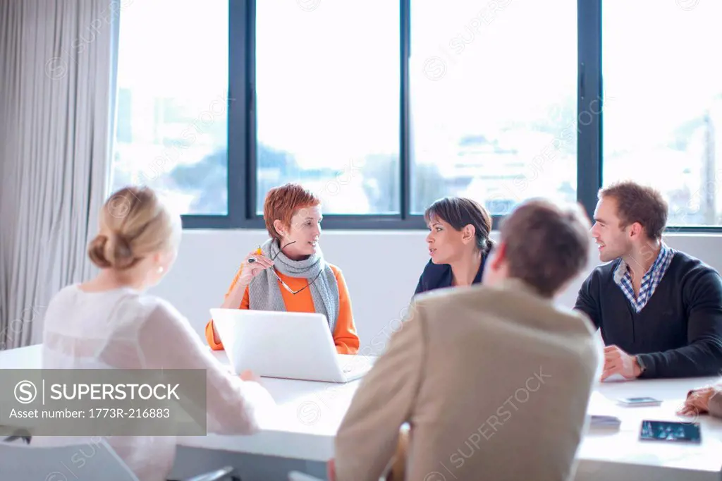 Businesspeople meeting around conference table