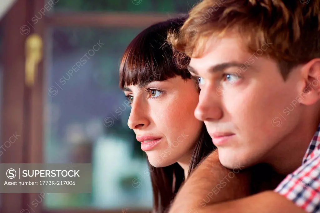 Portrait of couple looking away, close up