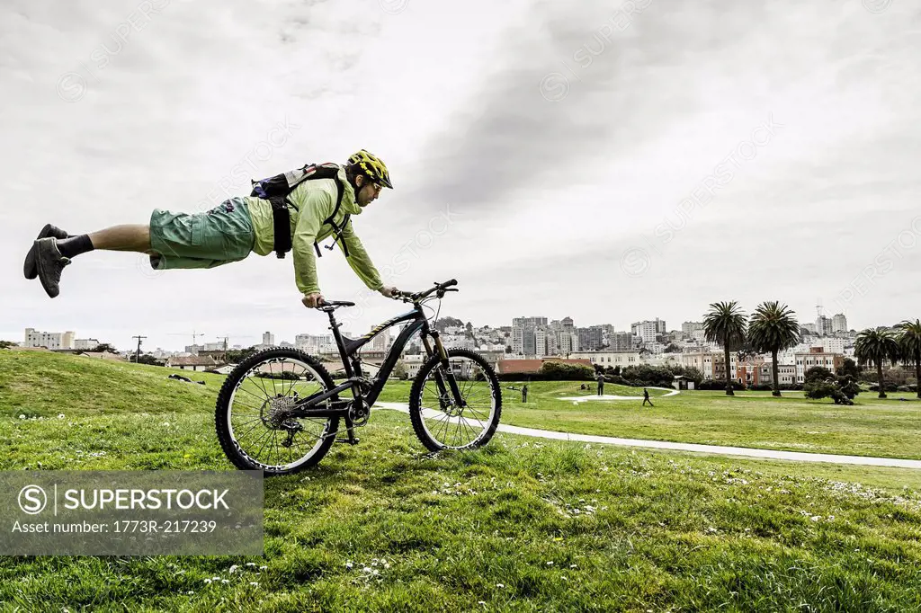 Cyclist balancing body on bike