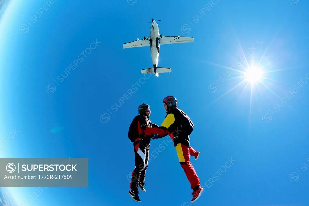 Female skydivers free falling above Leutkirch, Bavaria, Germany