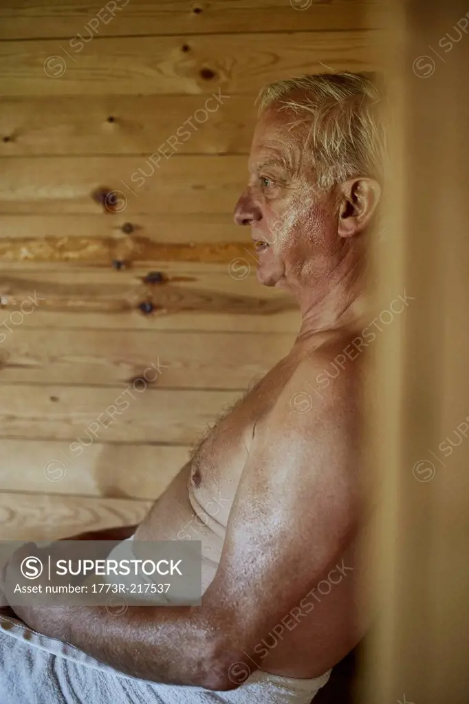 Close up of senior man sitting in sauna