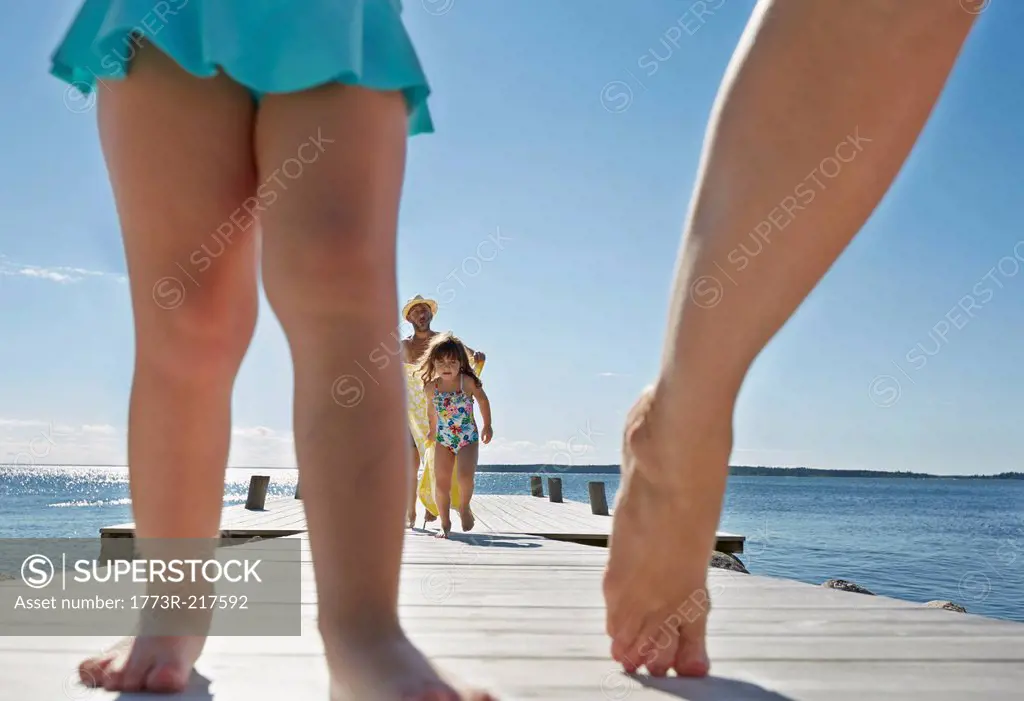 Close up of family walking on pier, Utvalnas, Gavle, Sweden