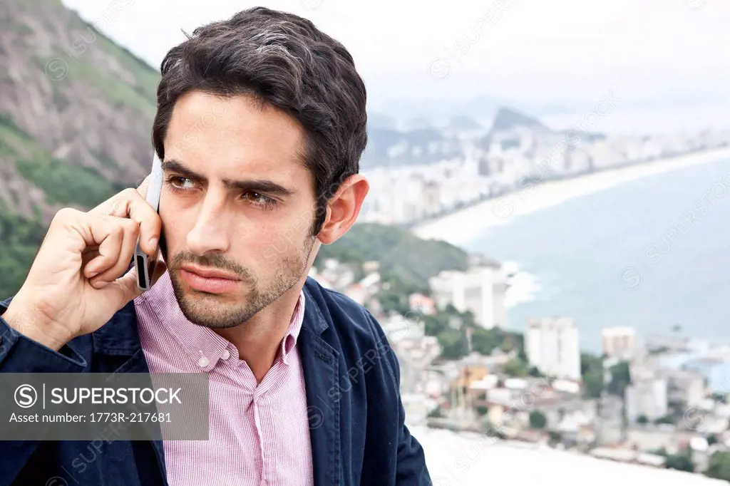 Young man on mobile, Casa Alto Vidigal, Rio De Janeiro, Brazil