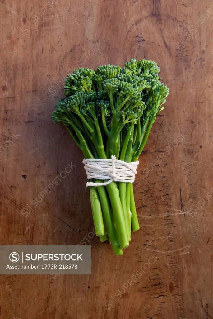 Bunch of broccoli tied with string, still life