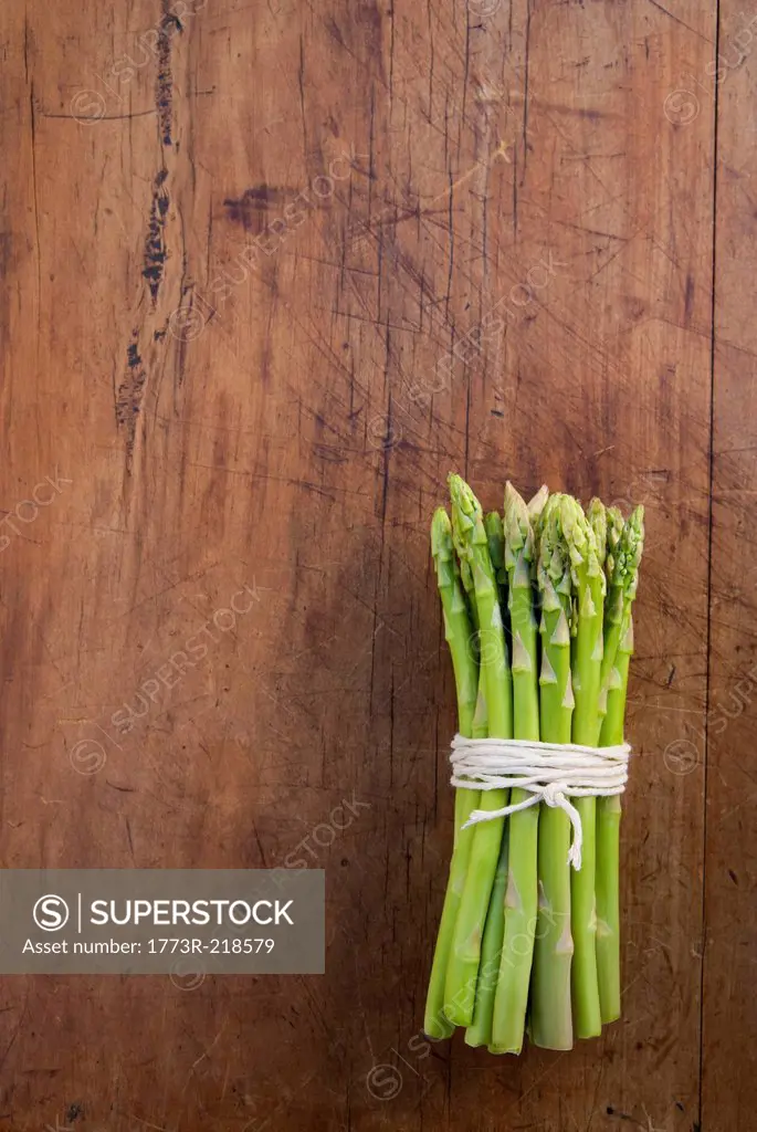 Bunch of asparagus tied with string, still life