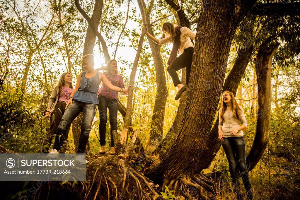 Five young women exploring woods