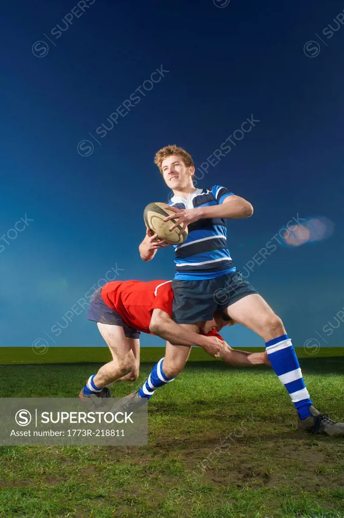 Young men playing rugby