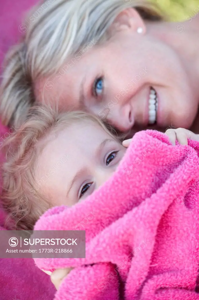 Mother and daughter in pink towel