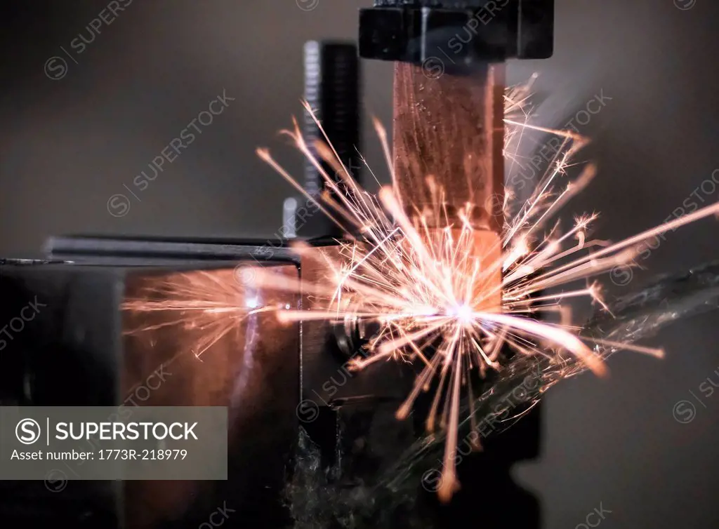 Spark from wire erosion machine in factory
