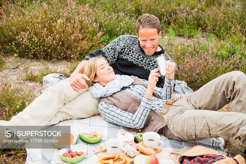 Mid adult couple having picnic