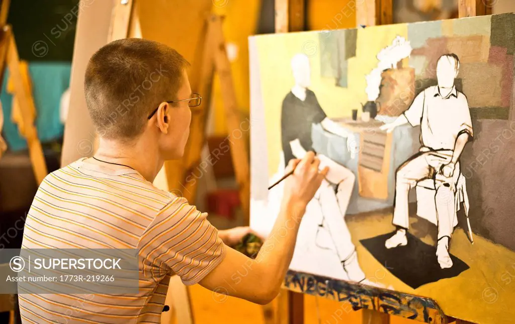 Young man painting picture