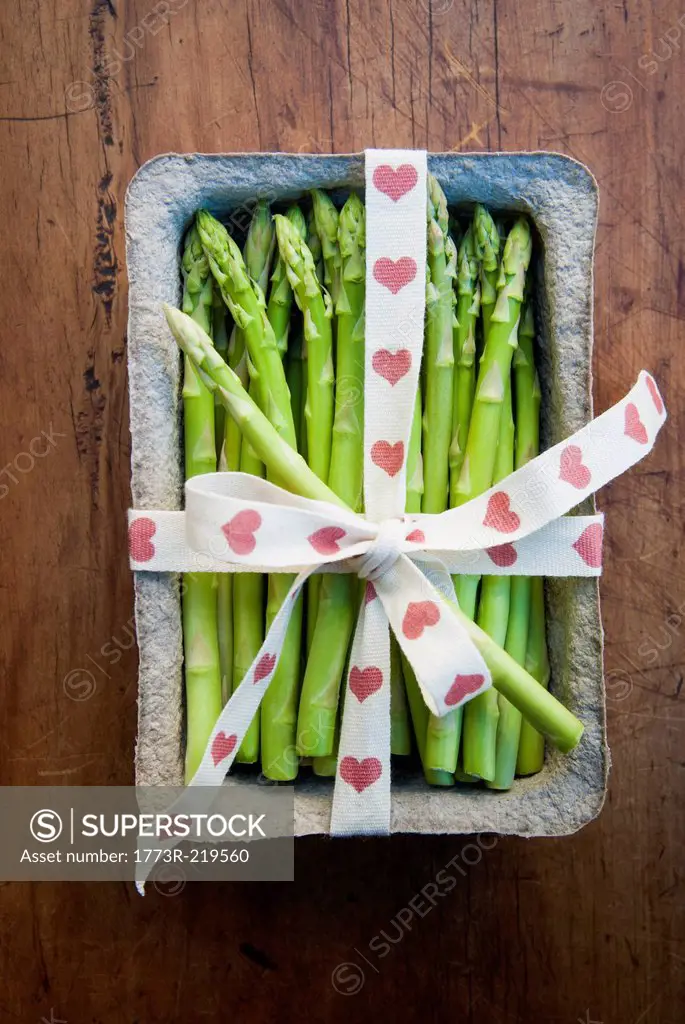 Tub of asparagus tied with ribbon