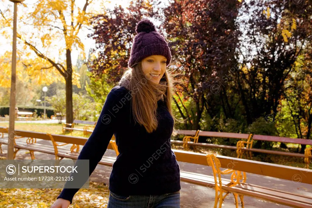Young woman enjoying autumn in park