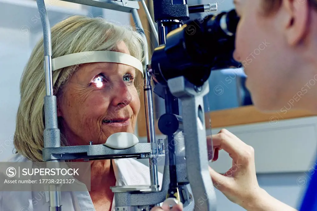 Female patient having eye tested in hospital