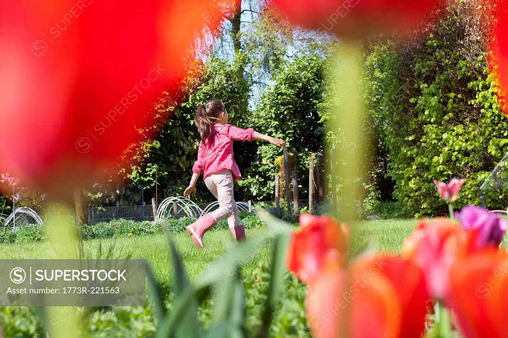 Girl playing in garden