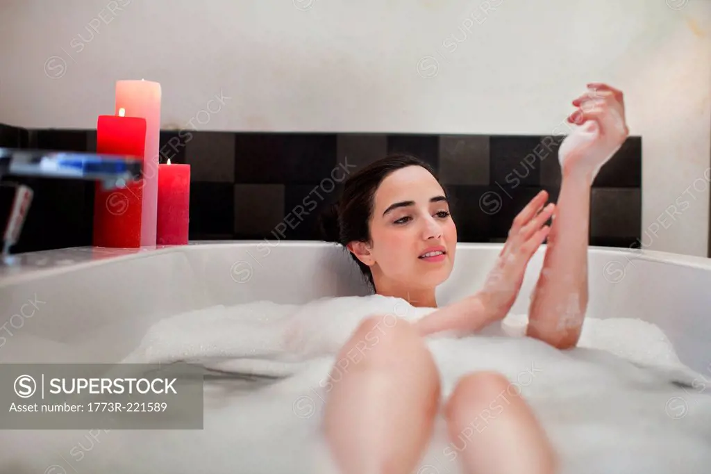 Young woman enjoying bubble bath