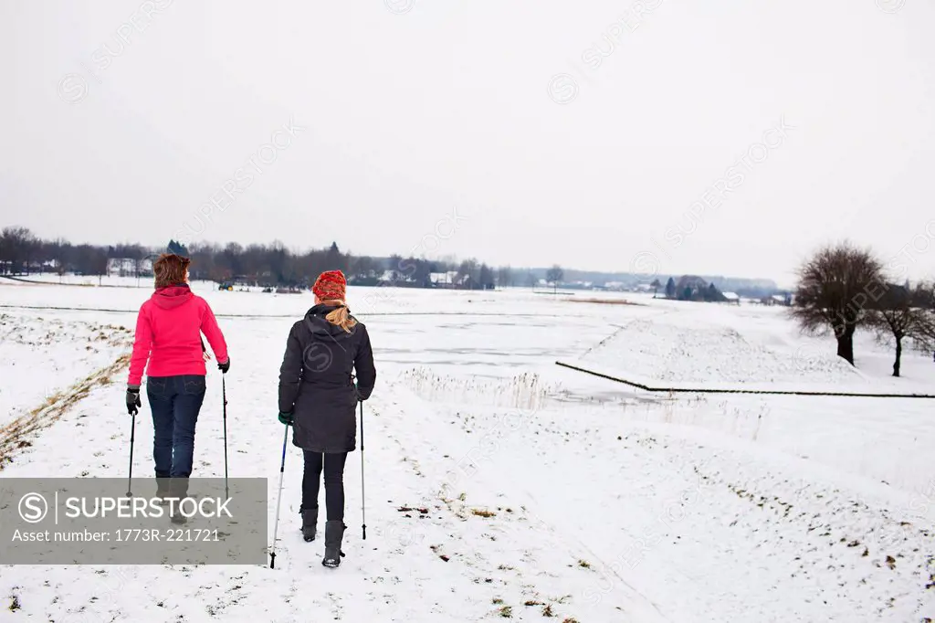 Women walking over ice