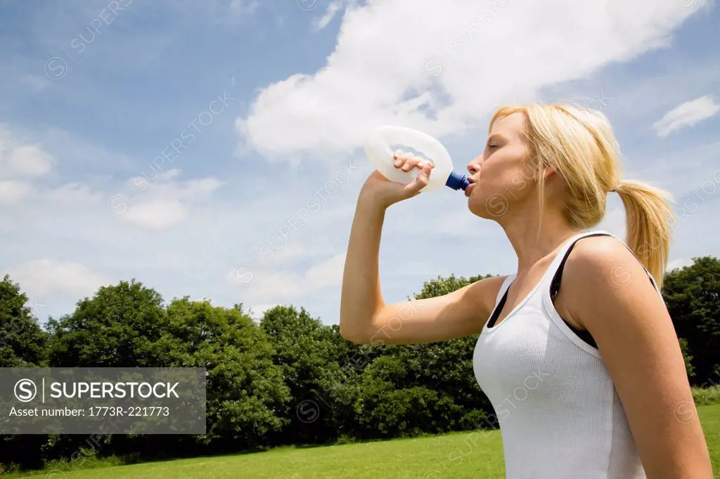 Jogger having drink of water
