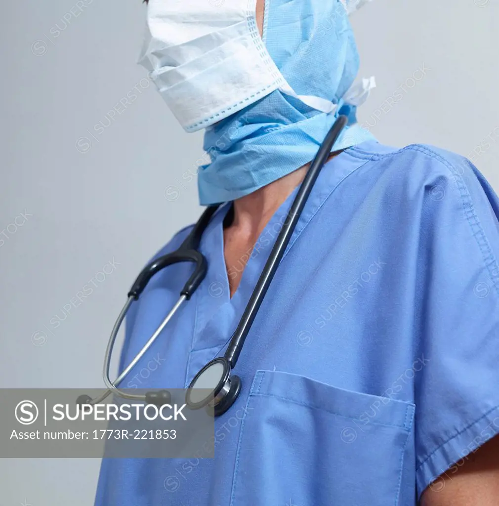 Surgeon wearing surgical scrubs and mask
