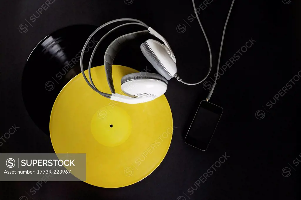 Vinyl record, headphones and mp3 player