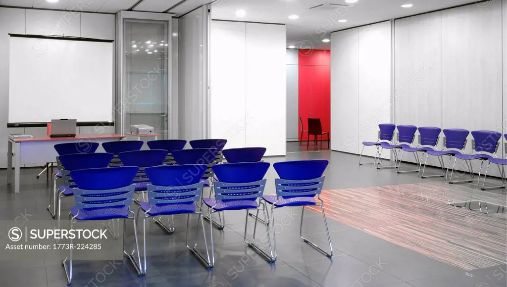 Blue chairs in conference room