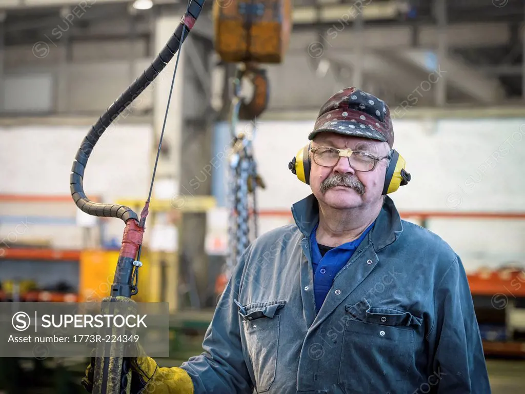 Portrait of crane operator in factory