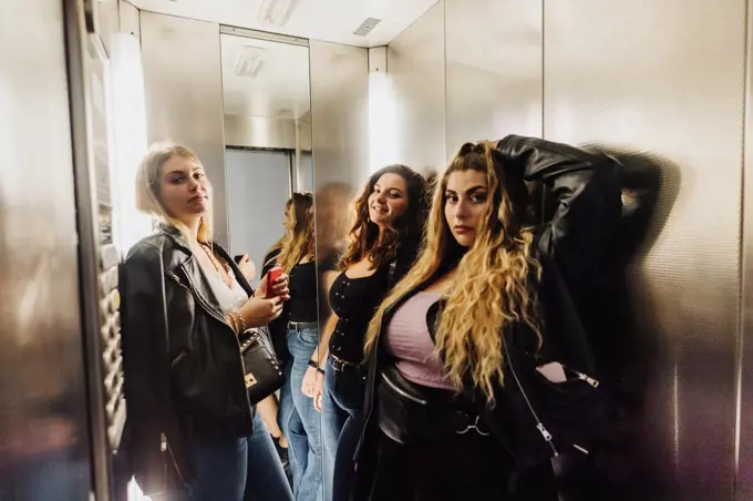 Three young women in elevator