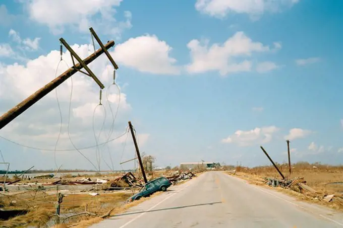 Fallen telephone poles and crashed car, aftermath of Hurricane Katrina, Cameron, Louisiana. USA