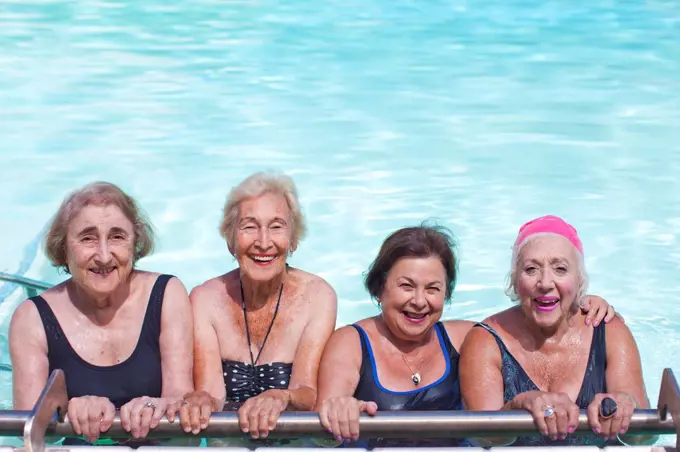 Portrait of four senior women in swimming pool