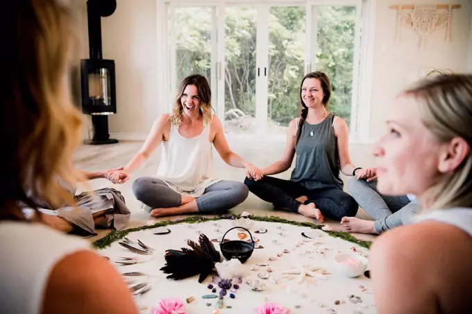 Women around circle in yoga retreat