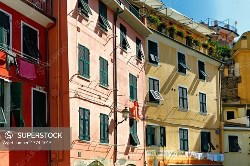 Italy, Liguria, Cinque Terre, Vernazza, Colorful building exteriors with windows and shutters