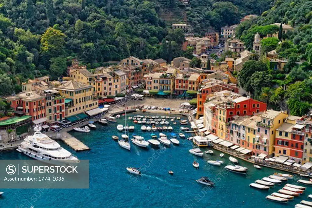 Italy, Liguria, Portofino, High angle view of small harbor with boats and yachts moored