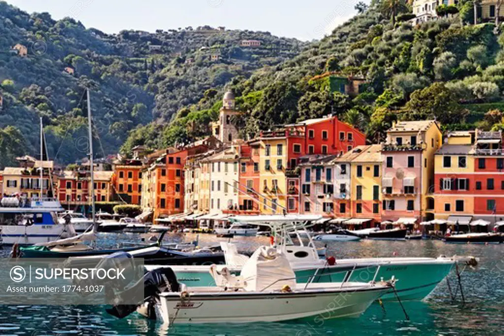 Italy, Liguria, Portofino, View of small boats in harbor surrounded by hills