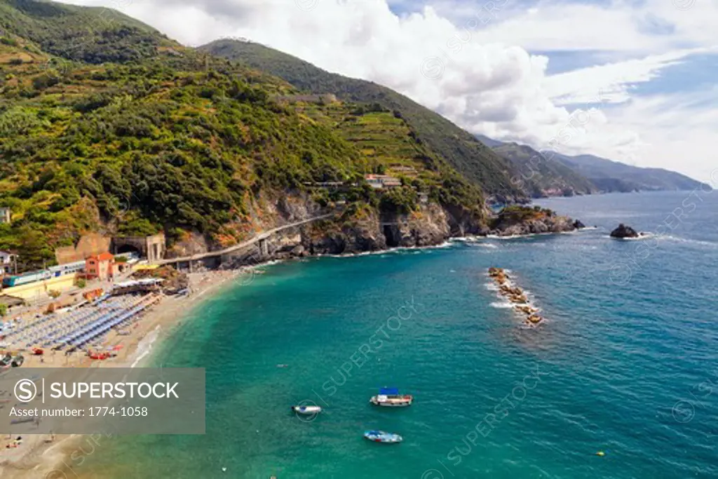 Italy, Liguria, Cinque Terre, Monterosso, High angle view of beach with train station