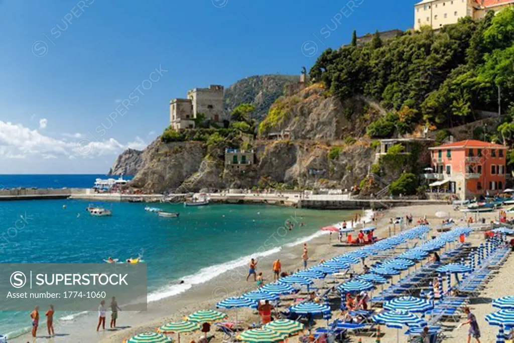 Italy, Liguria, Cinque Terre, Monterosso Al Mare, Umbrellas on beach