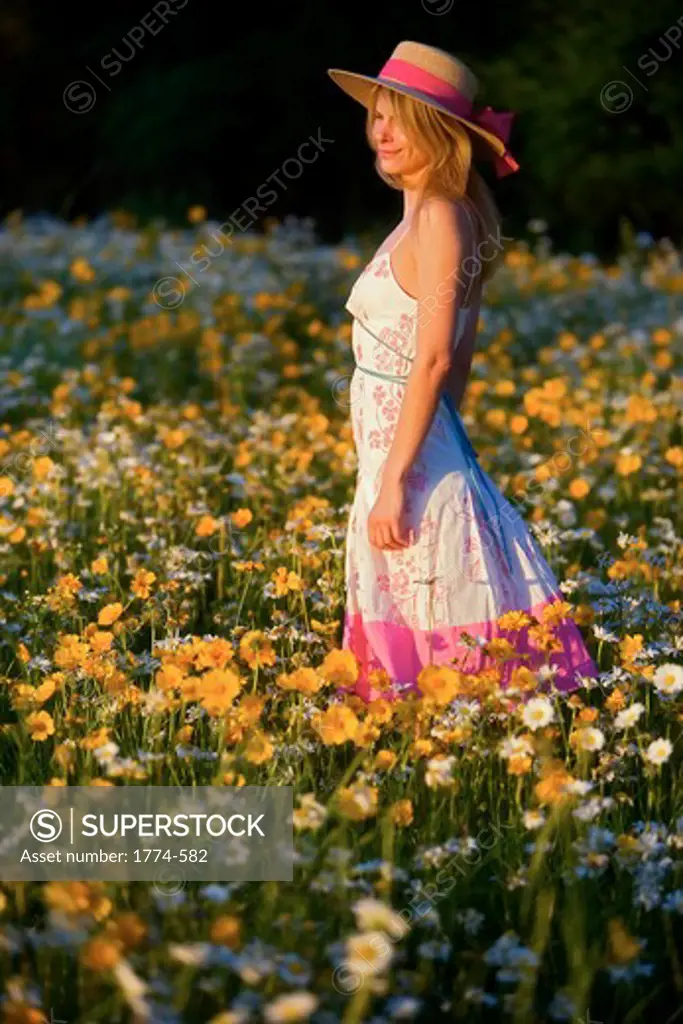 Young woman standing in a field, New Jersey, USA