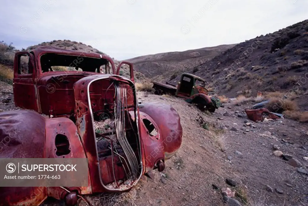 Old truck wrecks in a ravine, Death Valley, Death Valley National Park, California, USA