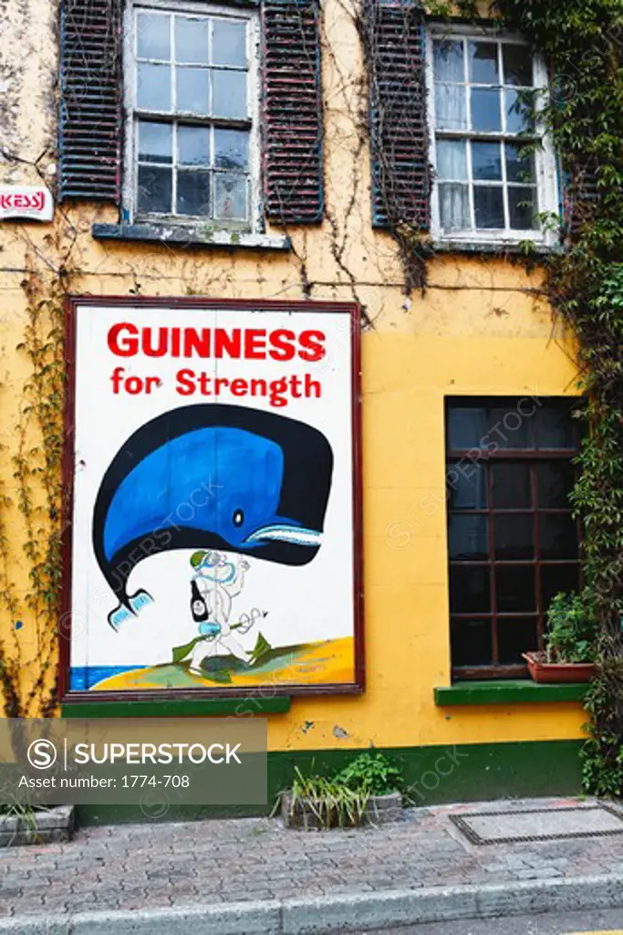 Ireland, County Cork, Kinsale, Old Guiness Sign on House